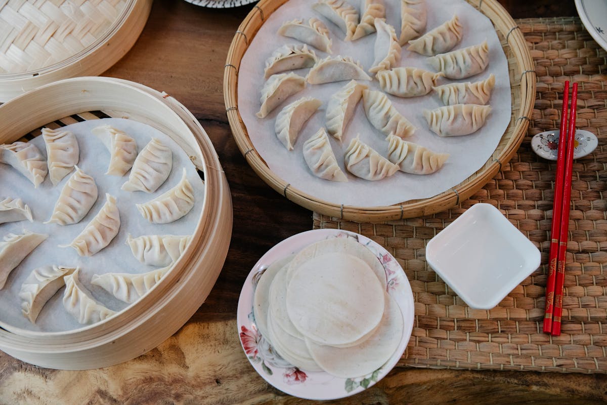 Handmade gyoza dumplings in bamboo steamers
